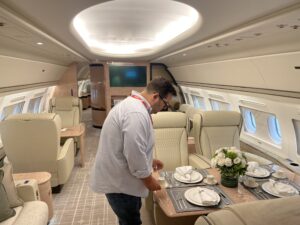 On-set production team styling cabin with catering and floral arrangements