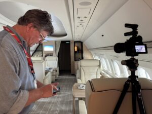 Aircraft Photographer Dave Koch capturing a bizliner jet Interior