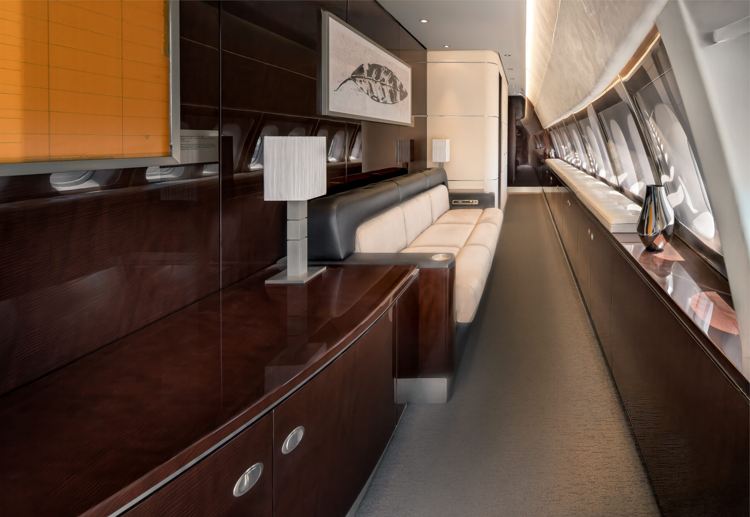 Elegant jet interior featuring custom leather seating, polished veneer finishes, and museum-quality cabin design.