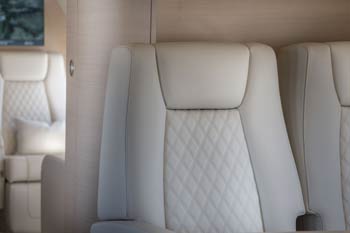 Luxury diamond-stitched private jet seats photographed at Macau International Airport.