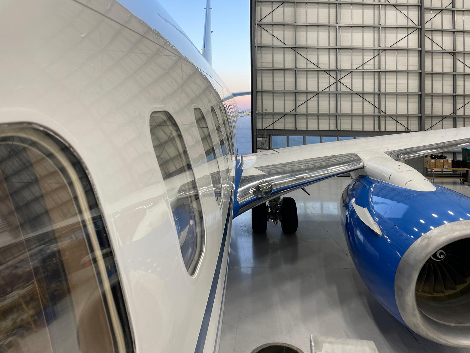 Private jet parked in a hangar at Paris Le Bourget Airport at sunrise, captured by aviation photographer Dave Koch.