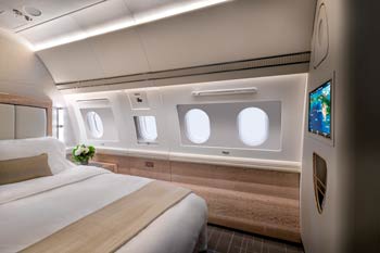 Private jet bedroom suite with full bed and soft beige luxury cabin finishes photographed in Jeddah at King Abdulaziz International Airport
