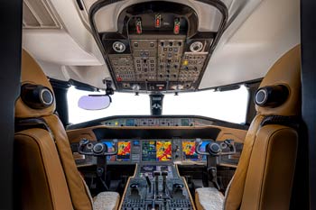 Private jet cockpit with modern avionics suite photographed in Sharjah at Sharjah International Airport.