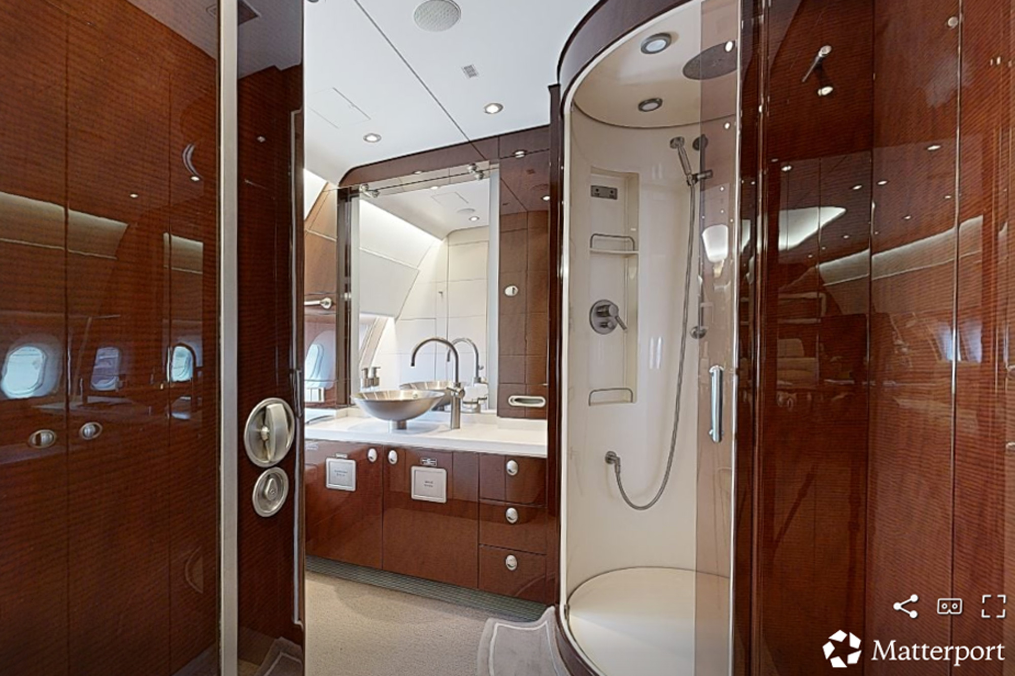 Private jet lavatory in Scottsdale with enclosed shower and luxury sink, photographed during a Matterport 3D aviation scan.